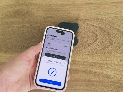 An iPhone scanning a black Anchor to start a Focus session
